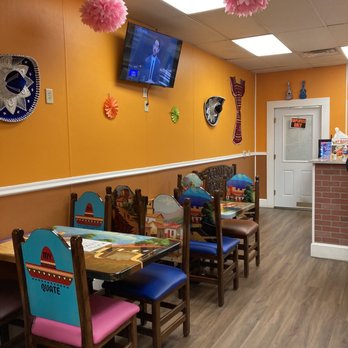 My Quate - a dining area with a television and a fireplace - Mexican Near Me - Hamilton Township, New Jersey My Quate - a dining area with a television and a fireplace - Mexican Near Me - Hamilton Township, New Jersey