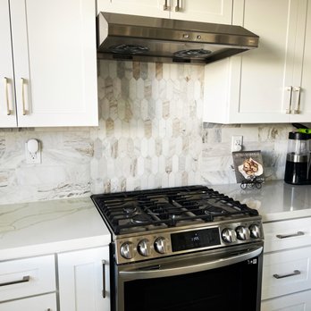 MPH Construction - a kitchen with white cabinets and stainless steel appliances - General Contractors Near Me - Irvine, California MPH Construction - a kitchen with white cabinets and stainless steel appliances - General Contractors Near Me - Irvine, California