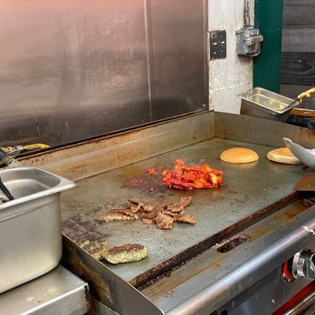 Gaters Restaurant - a grill with food cooking on it - Middle Eastern Near Me - Fremont, California Gaters Restaurant - a grill with food cooking on it - Middle Eastern Near Me - Fremont, California