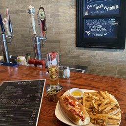 Lobster Roll with fresh cut fries, a Peroni draft and a side of hot peppers Lobster Roll with fresh cut fries, a Peroni draft and a side of hot peppers