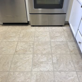 Luxor Floors - Old vinyl in the kitchen right next to he entryway - Flooring Near Me - Burlingame, California