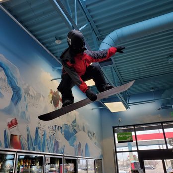 Maverik Adventure's First Stop - a snowboarder doing a trick in a store - Gas Stations Near Me - Meridian, Idaho