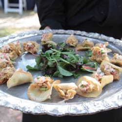 Fried oyster nacho on yucca chip with guacamole passed hors doeuvres
