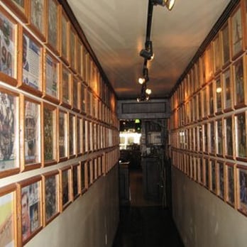 Downtown Lounge - a long corridor lined with framed photographs - Sports Bars Near Me - Lebanon, Pennsylvania