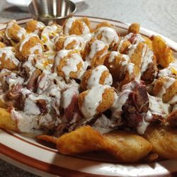 Nowhere On Route 66 - F5 Twister: Loaded sidewinder fries with pork, beef, bologna, Polish, chicken chunks, cheese, and ranch.