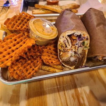 Spitz Mediterranean Street Food - Berliner wrap red sauce, feta, cabbage, carrot slaw, sumac, tomato, onion, cucumber, corn. Sweet potato fries and seasoned street fries - Mediterranean Near Me - Goodyear, Arizona Spitz Mediterranean Street Food - Berliner wrap red sauce, feta, cabbage, carrot slaw, sumac, tomato, onion, cucumber, corn. Sweet potato fries and seasoned street fries - Mediterranean Near Me - Goodyear, Arizona