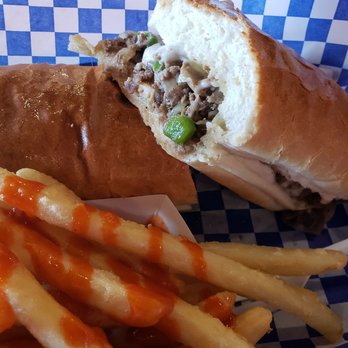 Pappa Geno's - Cheese steak with peppers, onions, mushrooms, provolone cheese and fries (added hot sauce) - Cheesesteaks Near Me - Deer Park, Texas