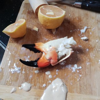 Incredible Stonecrab - a crab claw on a cutting board - Food Delivery Services Near Me - Miami, Florida