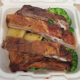 Half order of pork ribs with baked potato (2 whole potatoes!) and broccoli sides.