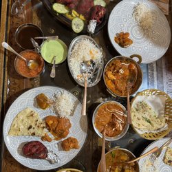 New Punjab - Chicken tandoori, butter chicken, chicken tiki masala, chicken vindaloo, garlic naan, butter naan, cheese naan, rice, samosas