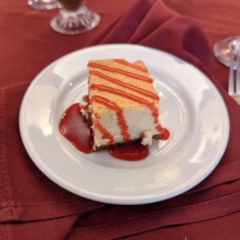 Zio Fraedo's - Cheesecake with strawberry sauce - Italian Near Me - Pleasant Hill, California Zio Fraedo's - Cheesecake with strawberry sauce - Italian Near Me - Pleasant Hill, California
