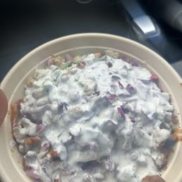 Rice bowl with everything except tomatoes and cilantro. White sauce. Rice bowl with everything except tomatoes and cilantro. White sauce.
