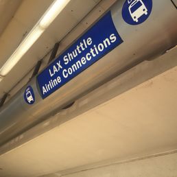 Stand under here to catch shuttle which takes you to train from the airport.
