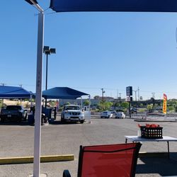 Elite Hand Car Wash - There is a waiting area with patio chairs under a tent. Or you can sit on the benches as well