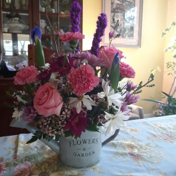 Schaefer Greenhouses - Assorted flowers in watering can vase - Nurseries & Gardening Near Me - Montgomery, Illinois