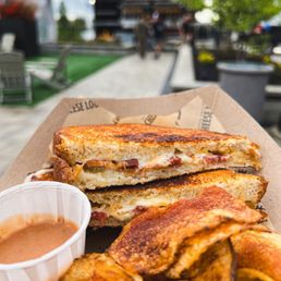 THE BACONATOR CRISPY BACON, CABOT CHEDDAR AND MUENSTER BLEND ON SOURDOUGH THE BACONATOR CRISPY BACON, CABOT CHEDDAR AND MUENSTER BLEND ON SOURDOUGH