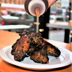 Mohio Pizza - Smoked chicken wings, chimichurri, chili-infused honey, lime.