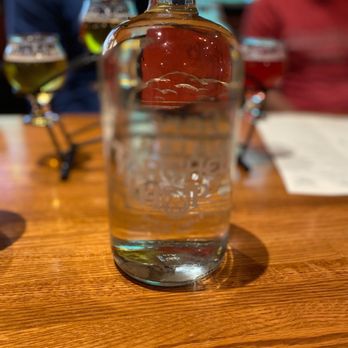 Torched Hop Brewing - a bottle of alcohol on a table - Gastropubs Near Me - Atlanta, Georgia Torched Hop Brewing - a bottle of alcohol on a table - Gastropubs Near Me - Atlanta, Georgia