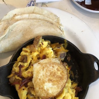 Oddfellows - The extra fried egg ordered.... They cut it for some odd reason - Breakfast & Brunch Near Me - Dallas, Texas
