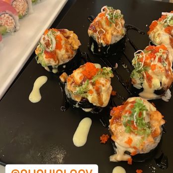 Sushiology - Fujiyama roll on the black plate. & Rainbow roll - Sushi Bars Near Me - Kennesaw, Georgia Sushiology - Fujiyama roll on the black plate. & Rainbow roll - Sushi Bars Near Me - Kennesaw, Georgia