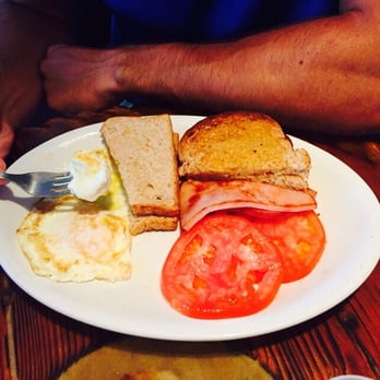 Lighthouse Cafe - Eggs over easy with ham and sliced tomatoes, if you haven't had tomatoes with eggs you definitely need to try. - Breakfast & Brunch Near Me - Sanibel, Florida Lighthouse Cafe - Eggs over easy with ham and sliced tomatoes, if you haven't had tomatoes with eggs you definitely need to try. - Breakfast & Brunch Near Me - Sanibel, Florida