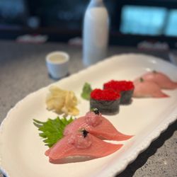 Okada Japanese Restaurant - 19. Yellowtail Sashimi 53. Tobiko Sushi 17. Tuna Sashimi