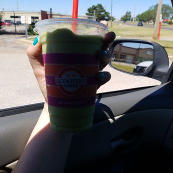 Scooter's Coffee - a hand holding a cup of coffee - Coffee & Tea Near Me - Oklahoma City, Oklahoma Scooter's Coffee - a hand holding a cup of coffee - Coffee & Tea Near Me - Oklahoma City, Oklahoma