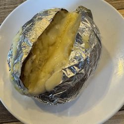 El Coco Pirata II - A baked potato.. basically the only thing I could eat in this place. This is exactly how it was served.