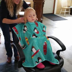 Coastal Creations Hair & Nail Salon - I' m giving this little girl her first hair cut.