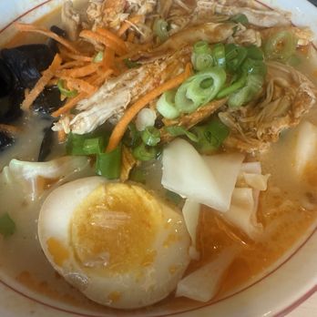 Maru Ramen - Tori (spicy shredded chicken) ramen - A bowl of ramen featuring shredded chicken, half a boiled egg, chopped green onions, and assorted vegetables in a broth. - Ramen Near Me - Ithaca, New York