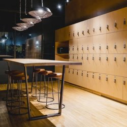 A clean locker area at our Thornton gym offers secure day use lockers along with comfortable seating and counter space for ad...