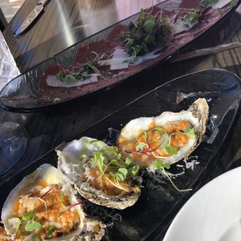 Subito - Parmesan bakes oysters and beef carpaccio - Italian Near Me - Cincinnati, Ohio