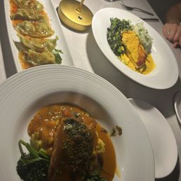 Salmon and risotto (subbed the grits), dumpling potstickers and halibut. Salmon and risotto (subbed the grits), dumpling potstickers and halibut.