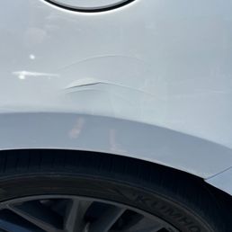 This is not a door ding and was done by the employee when he rotated the tires