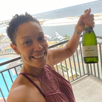 Emerald Grande Weddings - They sent a bottle of champagne to our room the day before the wedding.... Her photo - Resorts Near Me - Destin, Florida