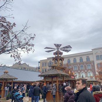 Carmel Christkindlmarkt - The cool windmill thing that is on top of the big drink stand where you get mulled wine and beer. It lights up and spins! - Skating Rinks Near Me - Carmel, Indiana Carmel Christkindlmarkt - The cool windmill thing that is on top of the big drink stand where you get mulled wine and beer. It lights up and spins! - Skating Rinks Near Me - Carmel, Indiana