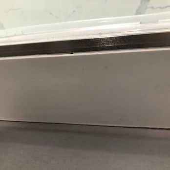 Sun Tile & More - The porcelain from shower pan is popping out and no caulking - Flooring Near Me - Glendora, California