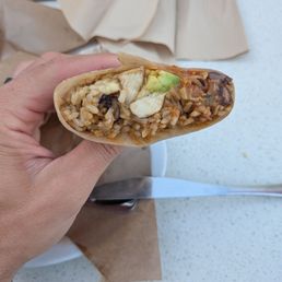 Half of my $19 burrito (Chicken Tinga Burrito). Felt more like rice panini. Value wasn't there for me. Half of my $19 burrito (Chicken Tinga Burrito). Felt more like rice panini. Value wasn't there for me.