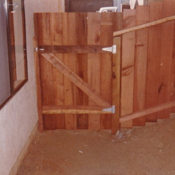 Cimarron Construction - Wood privacy fence and gate installed on uneven ground - General Contractors Near Me