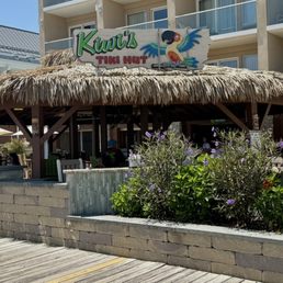 Exterior outside entrance of Kiwi's Kove - Kiwis Tiki Hut Boardwalk Entrance - Rehoboth Beach, Delaware Exterior outside entrance of Kiwi's Kove - Kiwis Tiki Hut Boardwalk Entrance - Rehoboth Beach, Delaware