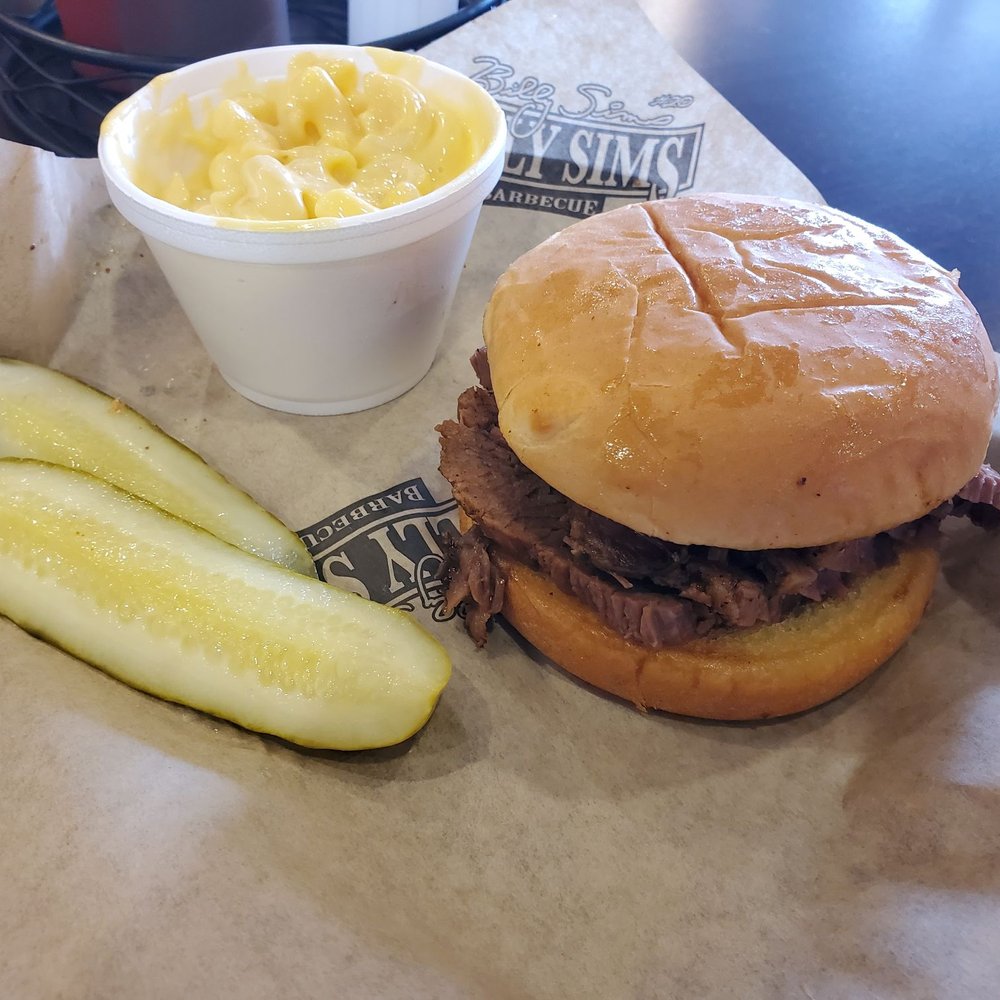 Billy Sims BBQ - a pulled pork sandwich with a side of macaroni and cheese - Barbeque Near Me - Norman, Oklahoma