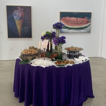 Rice Catering - a table with food and flowers - Caterers Near Me - Miami Beach, Florida Rice Catering - a table with food and flowers - Caterers Near Me - Miami Beach, Florida