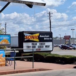 Street Sign Try Our Queso Wrap $1.99