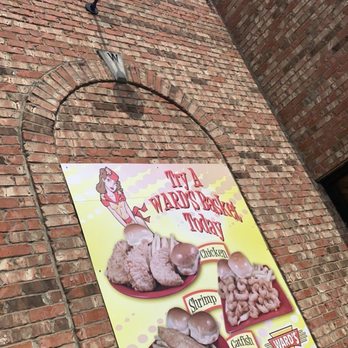Wards of Magee - a sign on a brick building - American Near Me - Magee, Mississippi