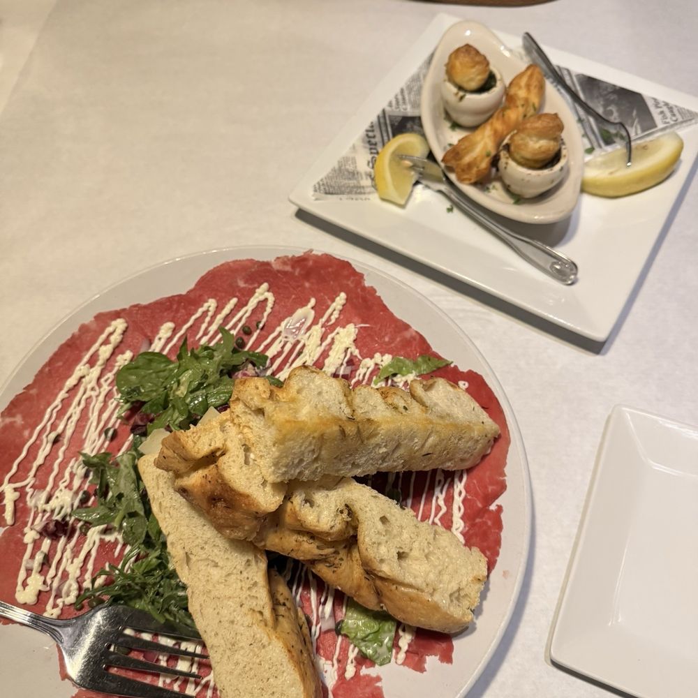 Beef carpaccio and Escargot de Bourgogne Beef carpaccio and Escargot de Bourgogne