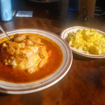 Denver Biscuit Co. - Colfax - Shrimp and grits in a biscuit bowl with a side of eggs. - Sandwiches Near Me - Denver, Colorado