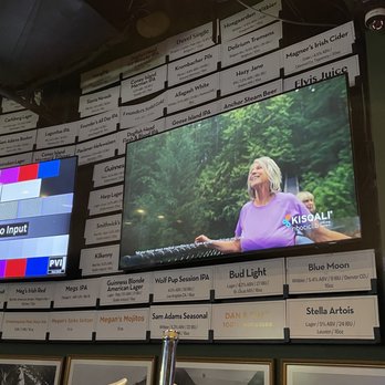 Megan's - a woman on a television screen - Irish Pub Near Me - New York, New York