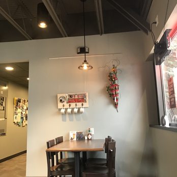 Dunn Brothers Coffee - a table and chairs in a coffee shop - Coffee & Tea Near Me - Minnetonka, Minnesota