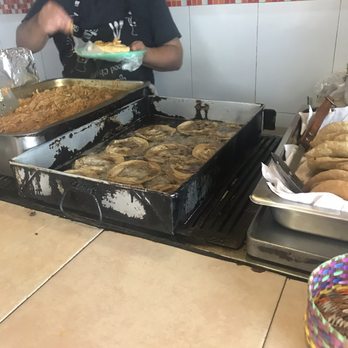 El Turix - A genius Mexican kitchen: panucho on the right (fryingtortilla with black beans) and cochinita pibil simmering on the left. 3/29/19 - Yucatan Near Me - México, D.F., DIF El Turix - A genius Mexican kitchen: panucho on the right (fryingtortilla with black beans) and cochinita pibil simmering on the left. 3/29/19 - Yucatan Near Me - México, D.F., DIF