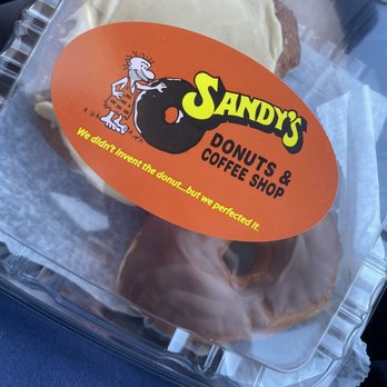 Sandy’s Donuts and Coffee - donuts in a plastic container - Donuts Near Me - Fargo, North Dakota Sandy’s Donuts and Coffee - donuts in a plastic container - Donuts Near Me - Fargo, North Dakota